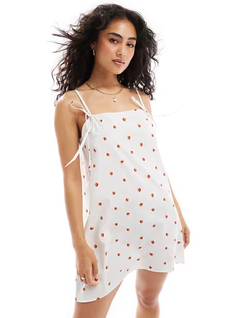 Poplin tie strap trapeze mini dress in strawberry print. Size: XS